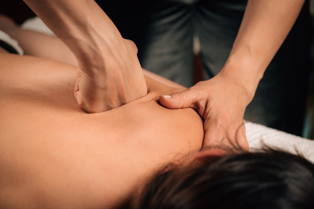 Massage Therapist performing the Deep Tissue Massage